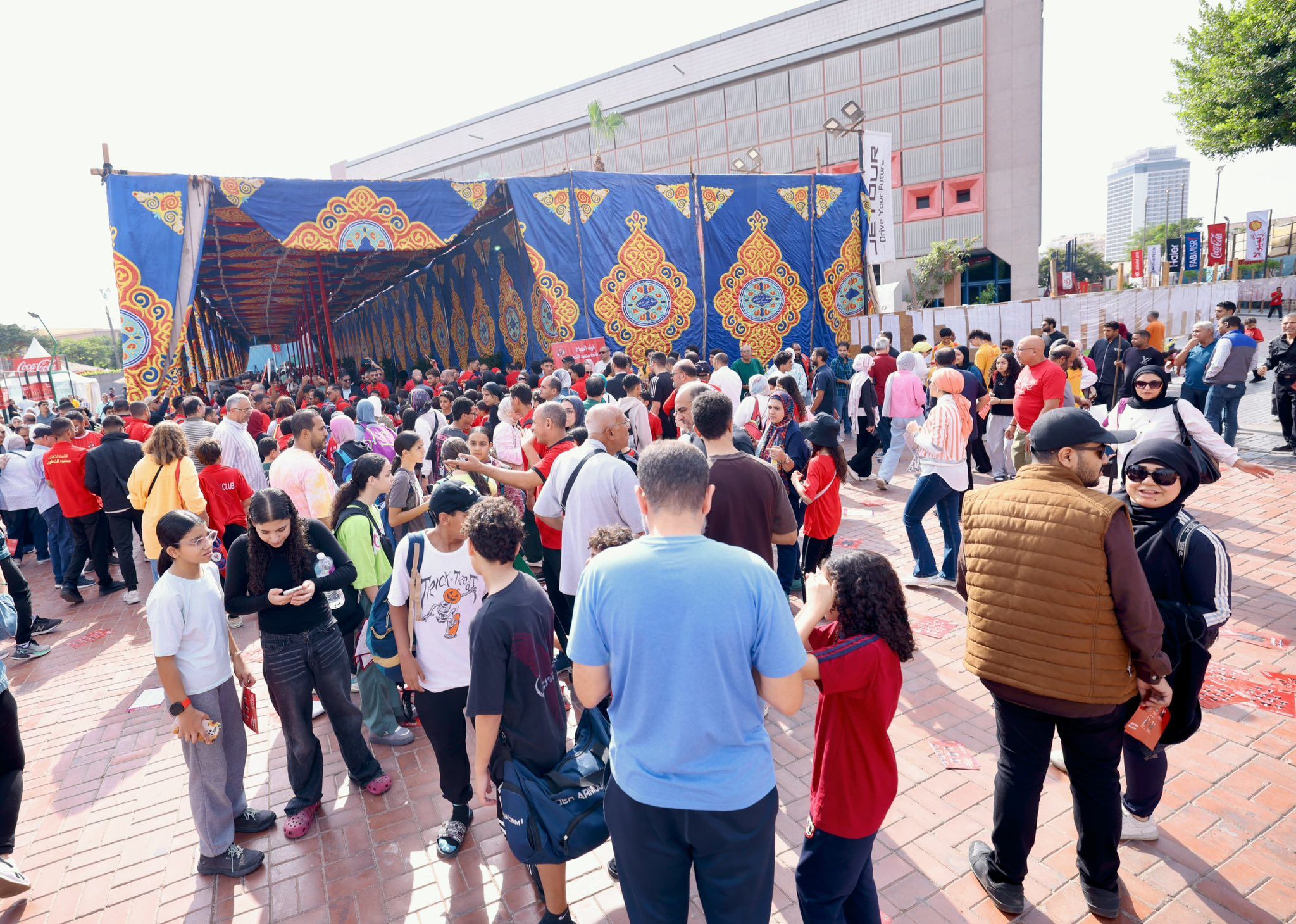 May be an image of one or more people, crowd and text